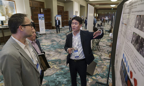 BCI Convention attendees learning about the Battery Research Poster Showcase entries.