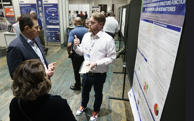 BCI Convention attendees learning about the Poster Research Showcase entries.