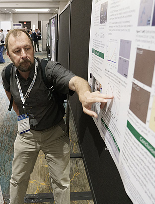Grad student presenting his research at the BCI Battery Poster Research Showcase. Grad student presenting his research at the BCI Battery Poster Research Showcase.